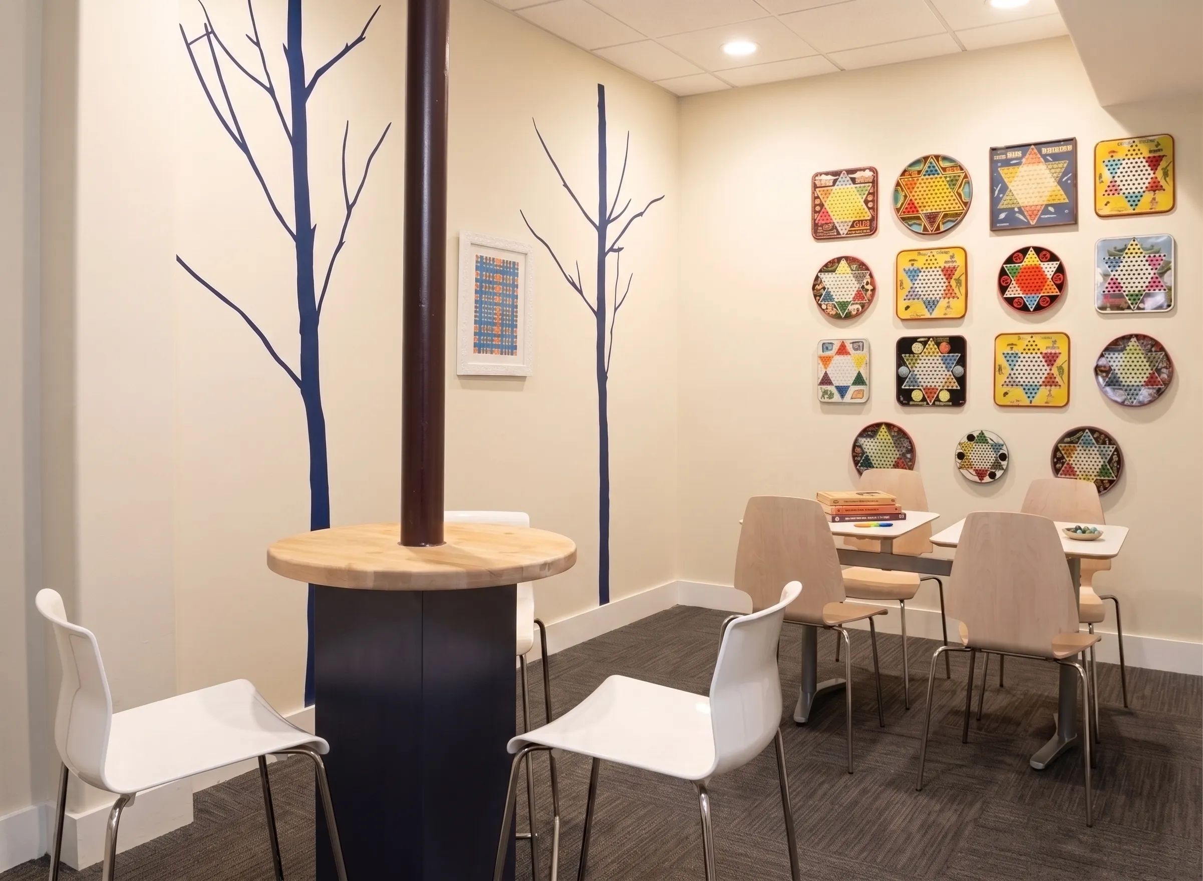 A warm, light-filled common room at The Lovett Center in Montrose, Houston, with seating arranged for people to gather.