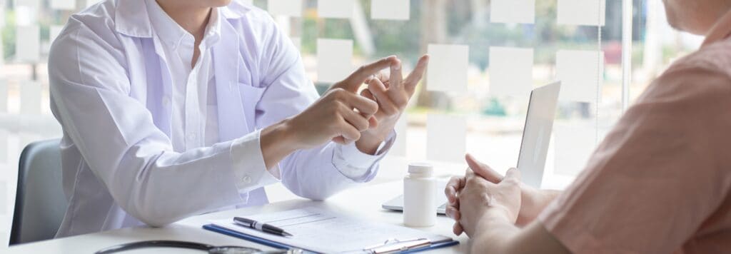 A medical professional discusses MAT services with a client during drug addiction treatment in Houston.