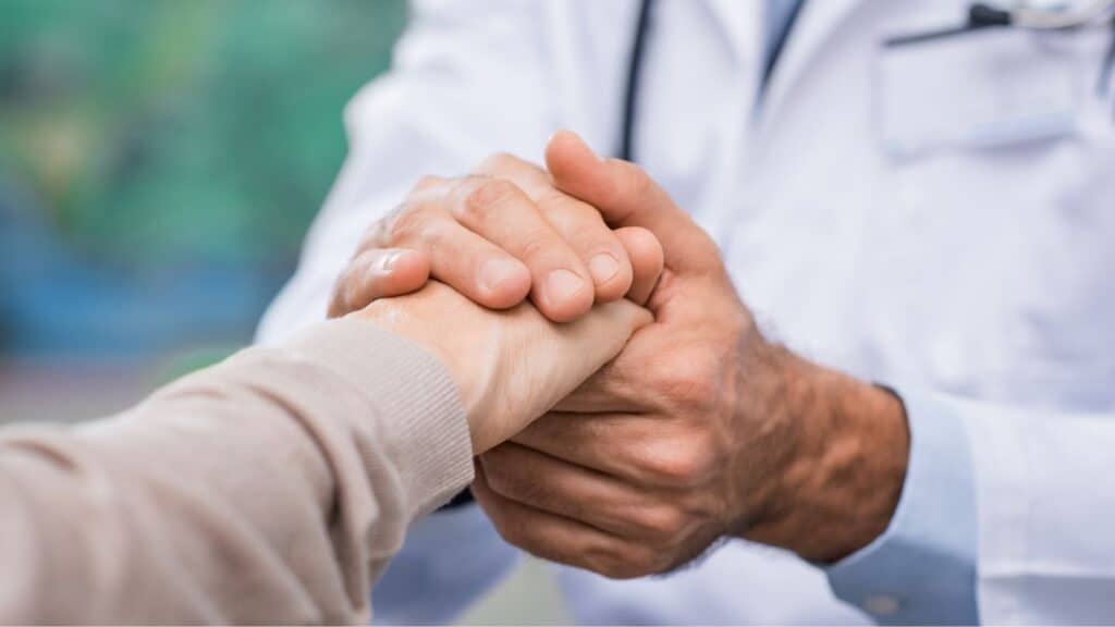 A professional supporting his client during bipolar disorder treatment. 