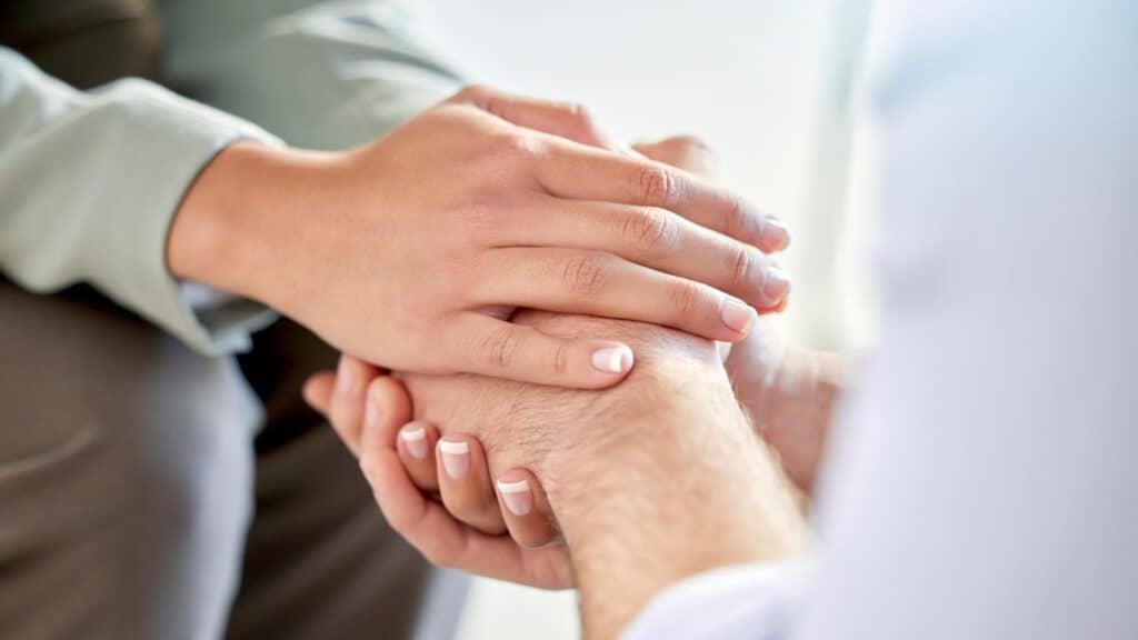 A professional offering support to a client during anxiety treatment in Houston. 