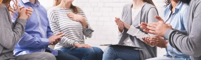 group session in houston discussing inpatient vs outpatient care