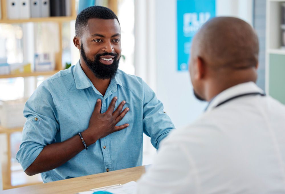 a man speaking to a doctor about insurance