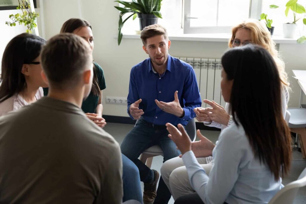 therapist sharing some information about Group Therapy in Houston, TX